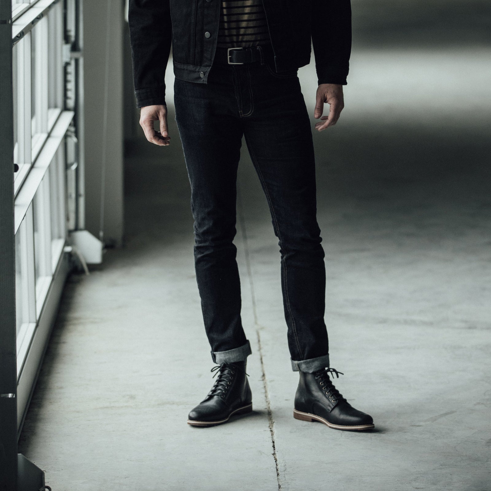 HELM - Man wearing the Zind Black wearing black jeans